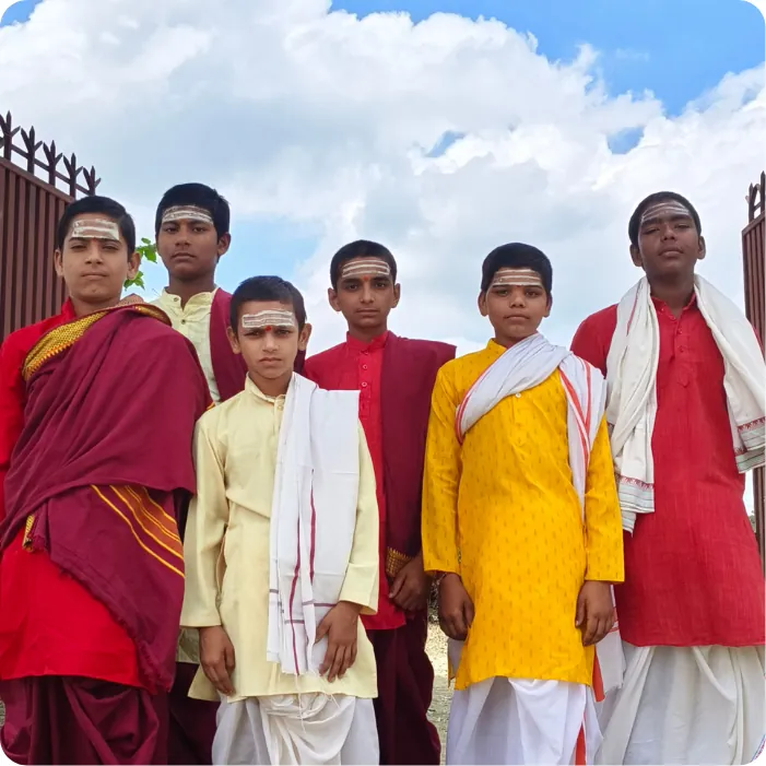 Gurukul students standing together in traditional attire