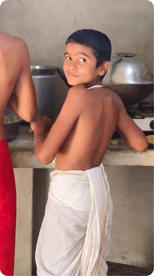Students washing utensils in the gurukul kitchen