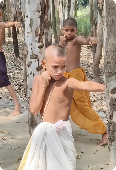 Students practising martial arts stances in a grove