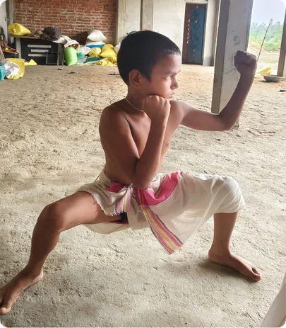 Young student holding a strong low fighting stance